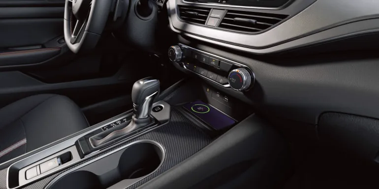 Close up on a phone wirelessly charging in the 2027 Nissan Altima sedan at Orr Nissan of Shreveport in Shreveport LA